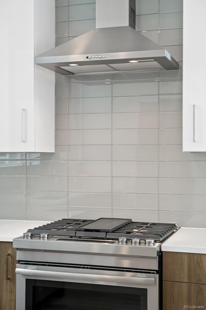 1624 Irving Street, Unit 1 Denver, CO 80204 - Photo 16 of 35 a stove top oven sitting inside of a kitchen