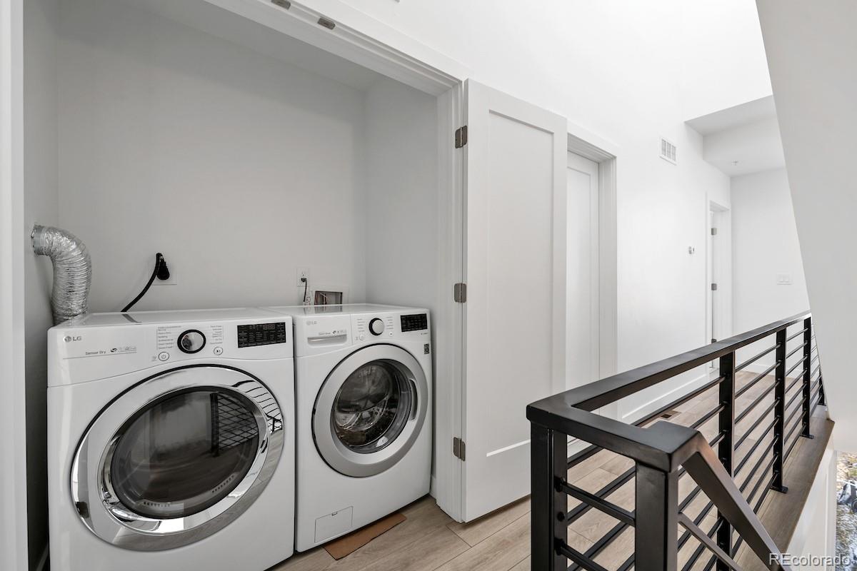 1624 Irving Street, Unit 1 Denver, CO 80204 - Photo 22 of 35 a view of a hallway with washer and dryer