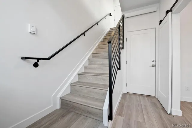 a view of entryway with wooden floor