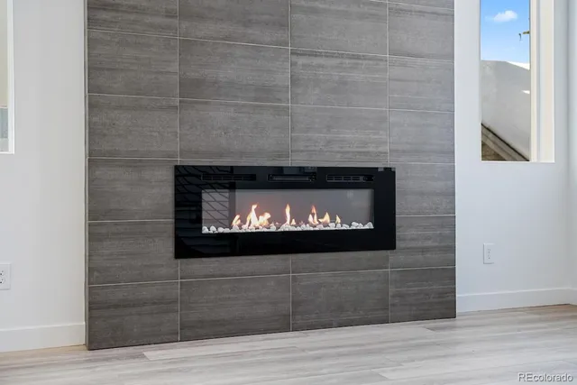a fireplace with wooden frame