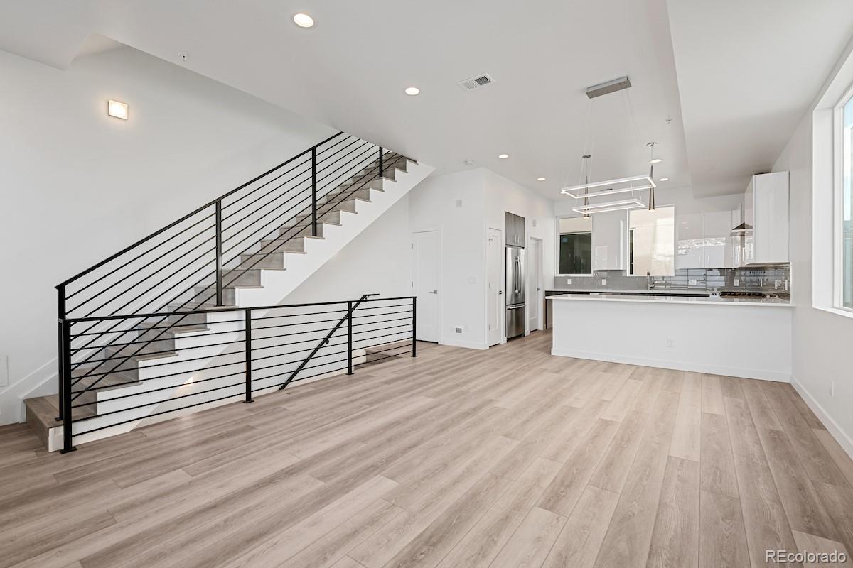 1624 Irving Street, Unit 1 Denver, CO 80204 - Photo 9 of 35 a view of kitchen with furniture and wooden floor