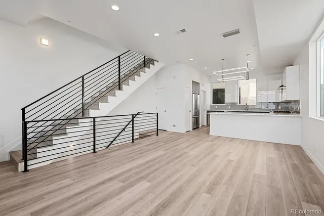 a view of kitchen with furniture and wooden floor