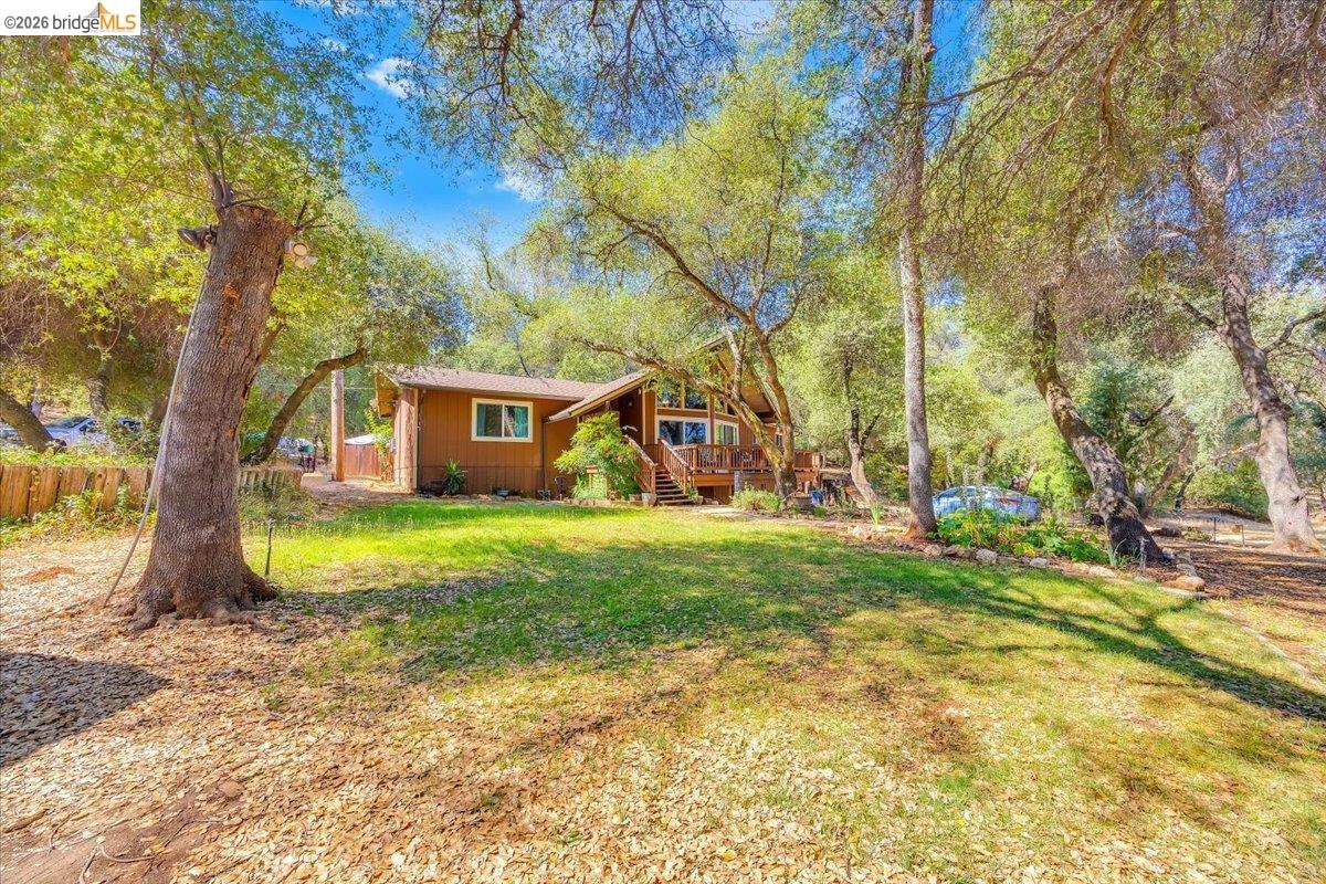 8733 Fraguero Road Sonora, CA 95370 - Photo 11 of 73 Wood-sided residence surrounded by mature trees