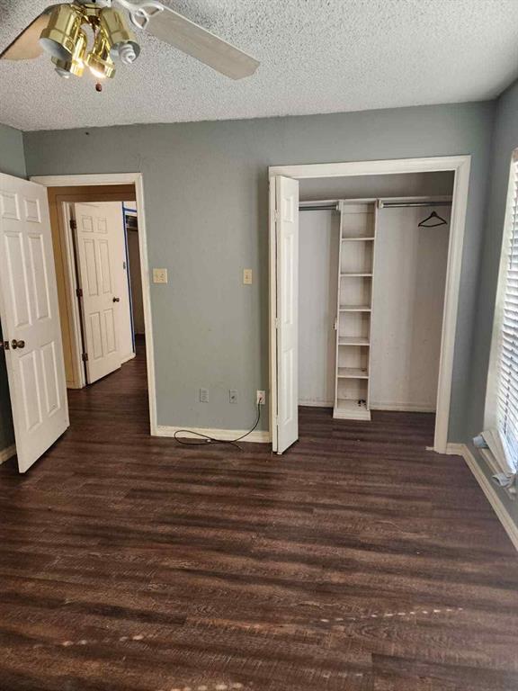 1316 Edna Street Commerce, TX 75428 - Photo 10 of 16 an empty room with wooden floor and closet