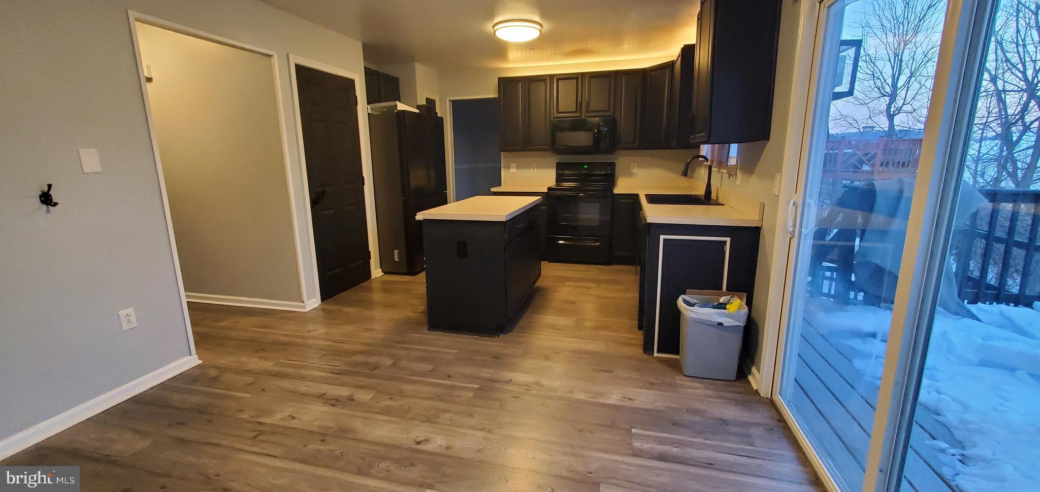 49 Villa Avenue Boyertown, PA 19512 - Photo 4 of 30 a view of kitchen with stainless steel appliances granite countertop a refrigerator and a wooden floor