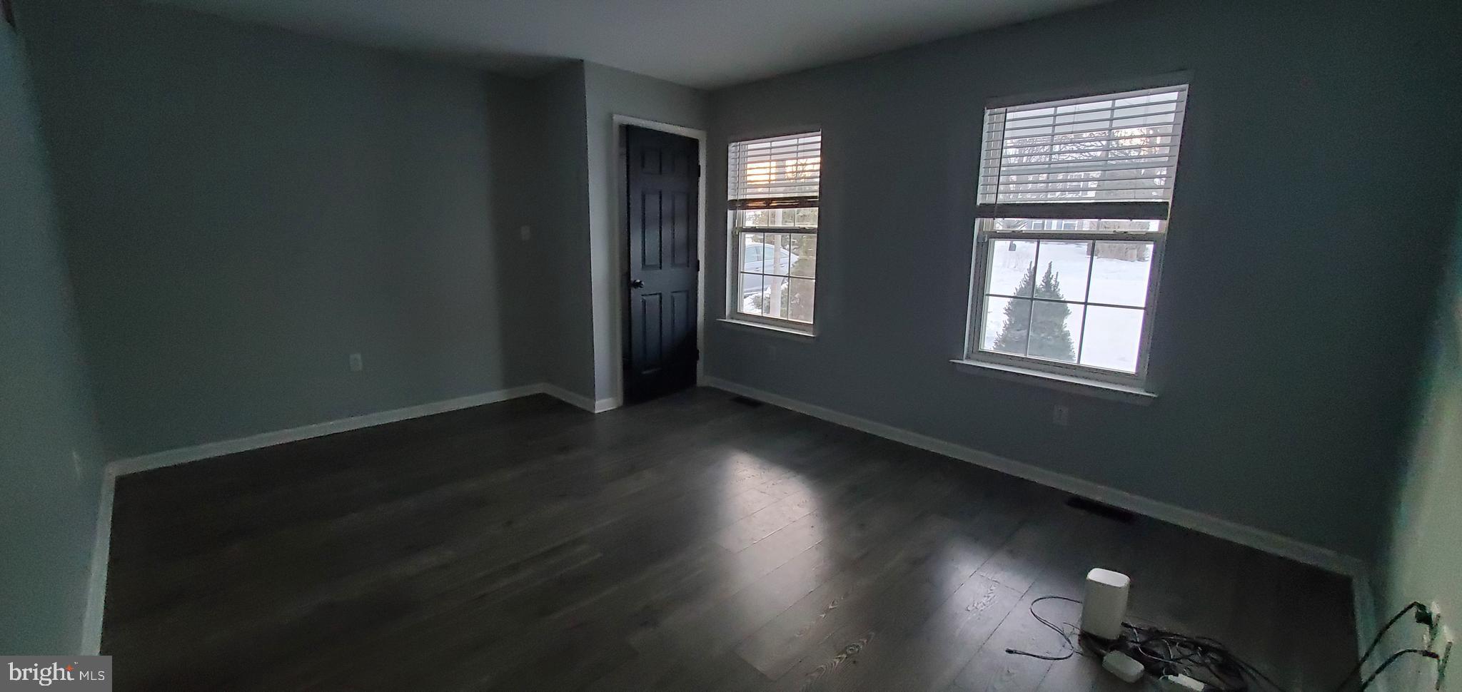 49 Villa Avenue Boyertown, PA 19512 - Photo 6 of 30 an empty room with wooden floor and windows