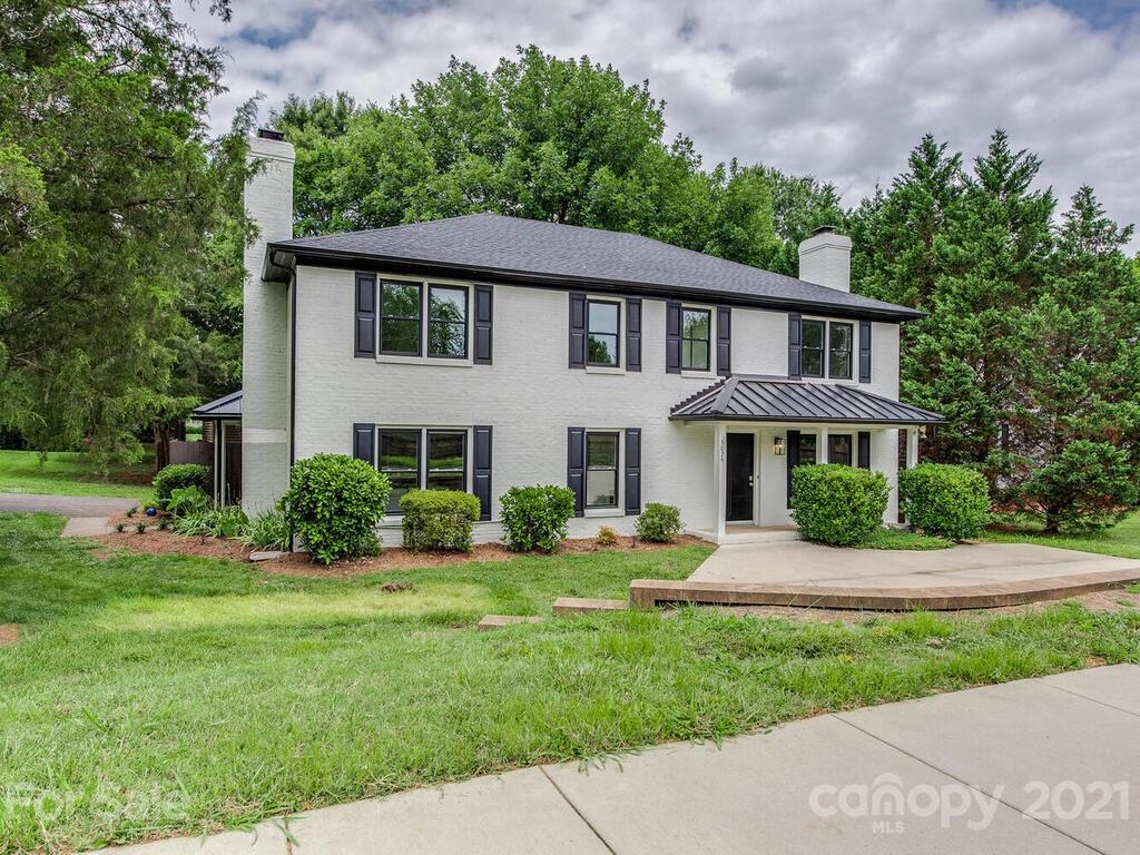 5024 Rea Road Charlotte, NC 28226 - Photo 1 of 19 a front view of a house with a yard