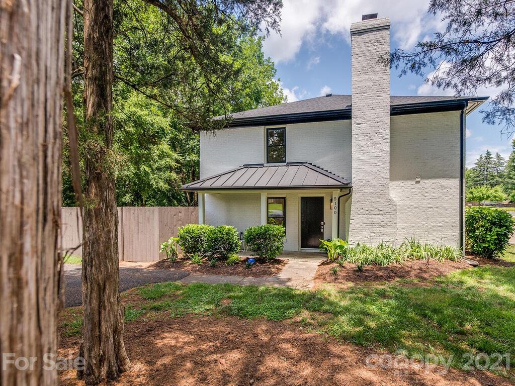 5024 Rea Road Charlotte, NC 28226 - Photo 2 of 19 a front view of a house with garden