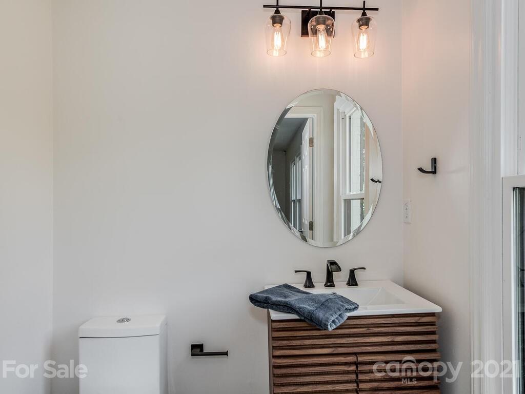5024 Rea Road Charlotte, NC 28226 - Photo 11 of 19 a bathroom with a sink and a mirror