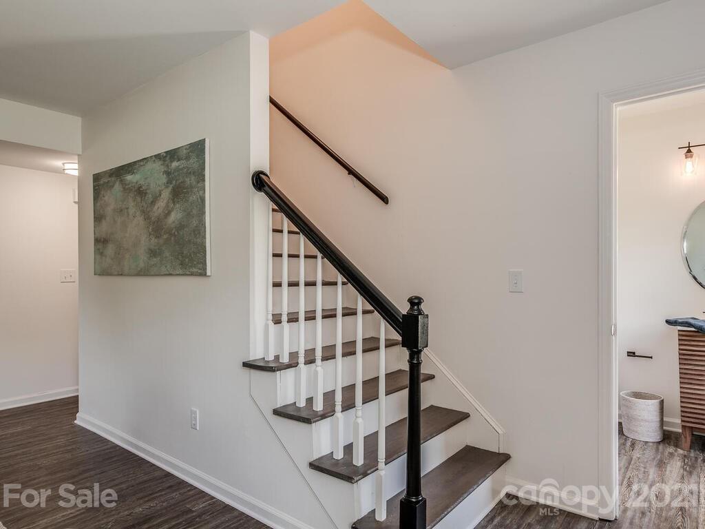 5024 Rea Road Charlotte, NC 28226 - Photo 12 of 19 a view of entryway and hall with wooden floor