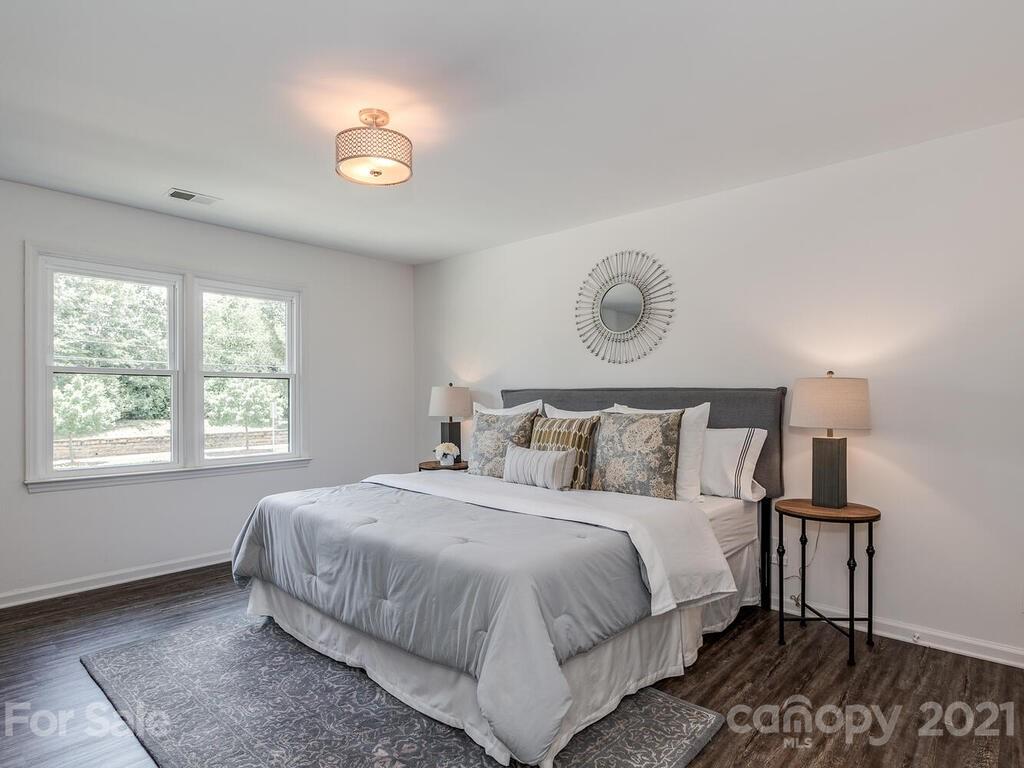 5024 Rea Road Charlotte, NC 28226 - Photo 13 of 19 a bedroom with a bed and a window