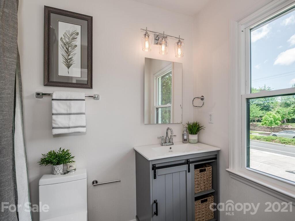 5024 Rea Road Charlotte, NC 28226 - Photo 16 of 19 a bathroom with a sink and a mirror