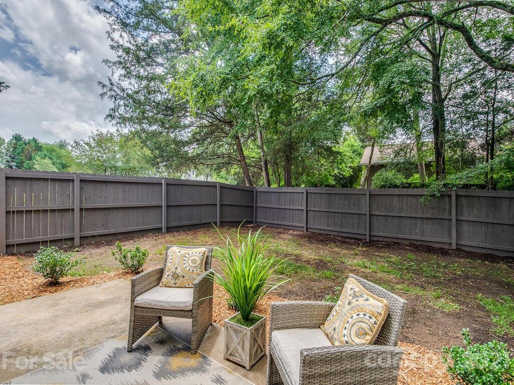 5024 Rea Road Charlotte, NC 28226 - Photo 19 of 19 a view of a chair and tables in the backyard