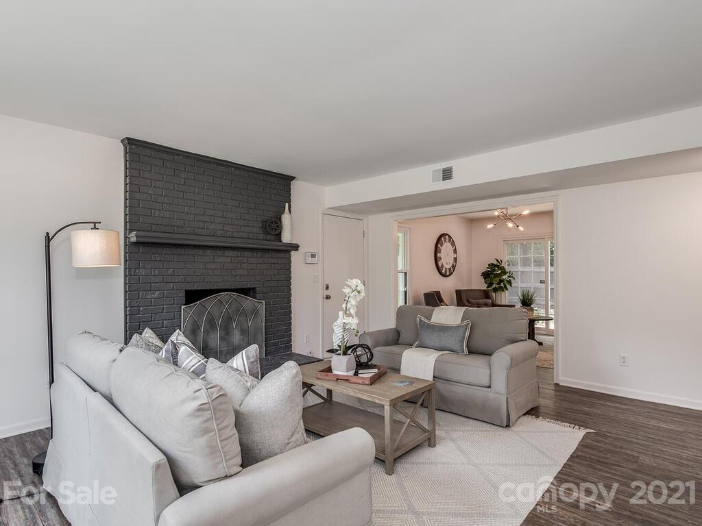 5024 Rea Road Charlotte, NC 28226 - Photo 5 of 19 a living room with furniture and a fireplace