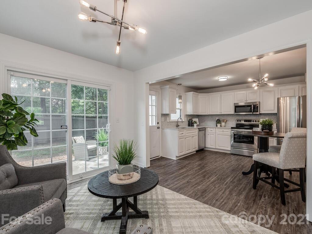 5024 Rea Road Charlotte, NC 28226 - Photo 7 of 19 a living room with furniture and a view of kitchen