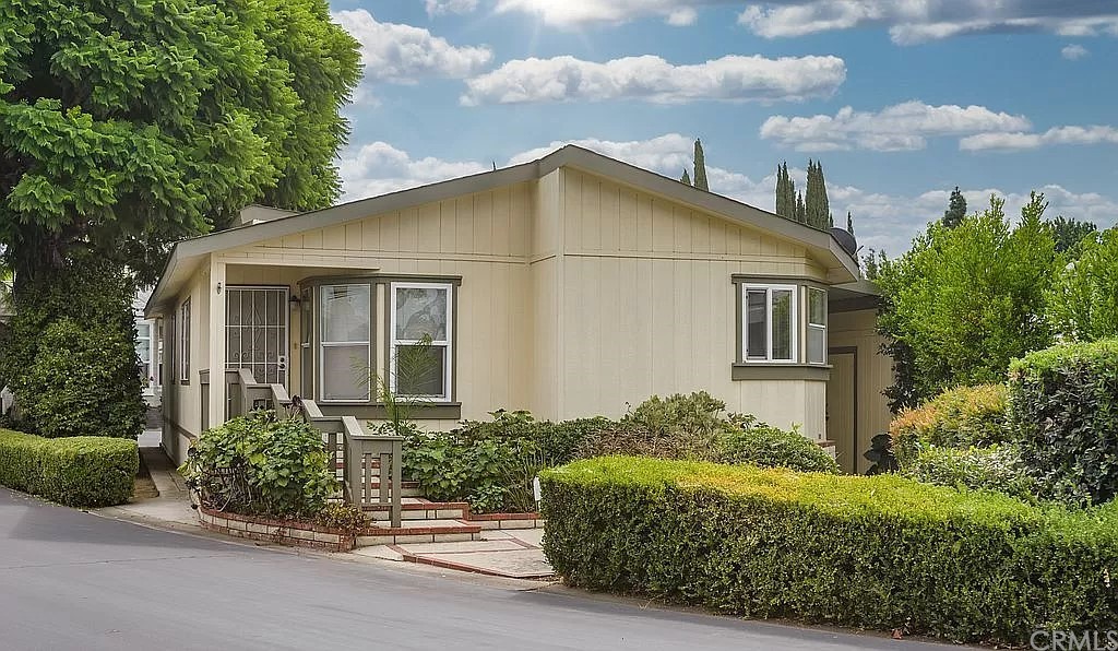 12 Saddleback Road Tustin, CA 92780 - Photo 1 of 1 a view of a house with a small yard and plants