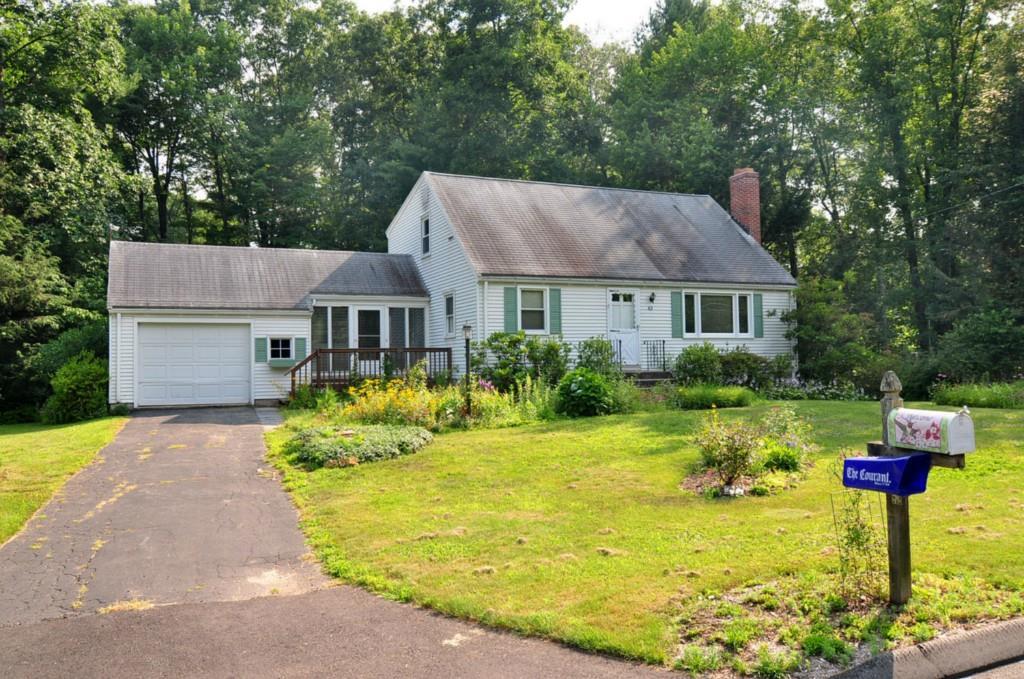 43 Northwoods Road Farmington, CT 06032 - Photo 1 of 1 a front view of house with yard and green space