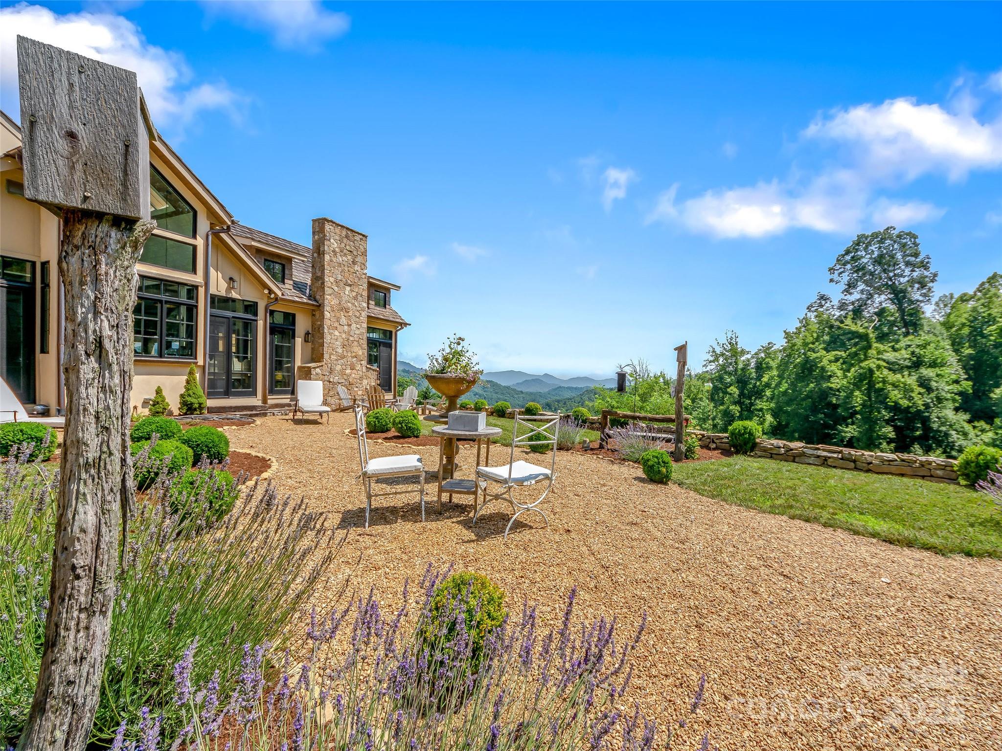 384 Doan Town Road Burnsville, NC 28714 - Photo 11 of 44 a view of a backyard with sitting area