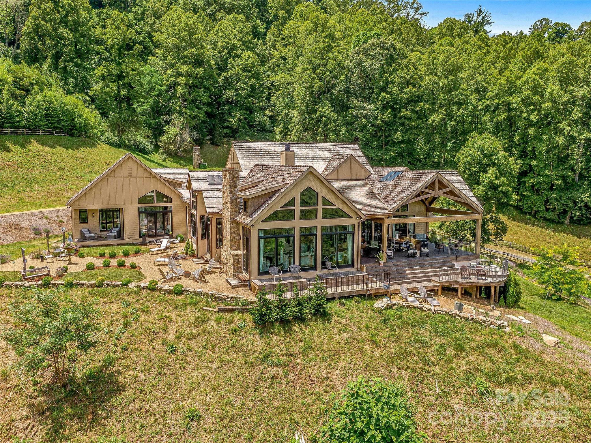 384 Doan Town Road Burnsville, NC 28714 - Photo 14 of 44 a front view of a house with swimming pool