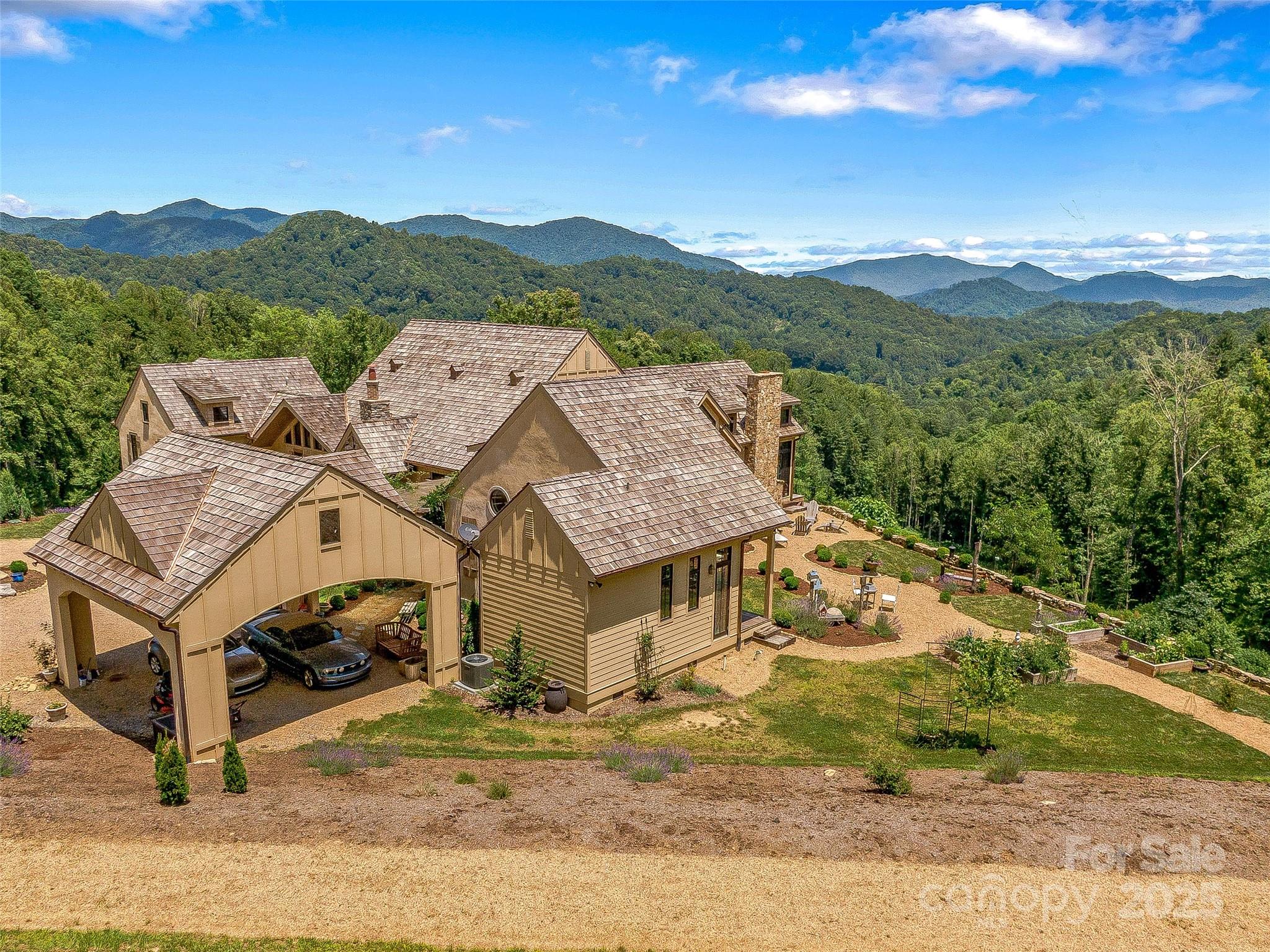 384 Doan Town Road Burnsville, NC 28714 - Photo 15 of 44 an aerial view of a house with a mountain