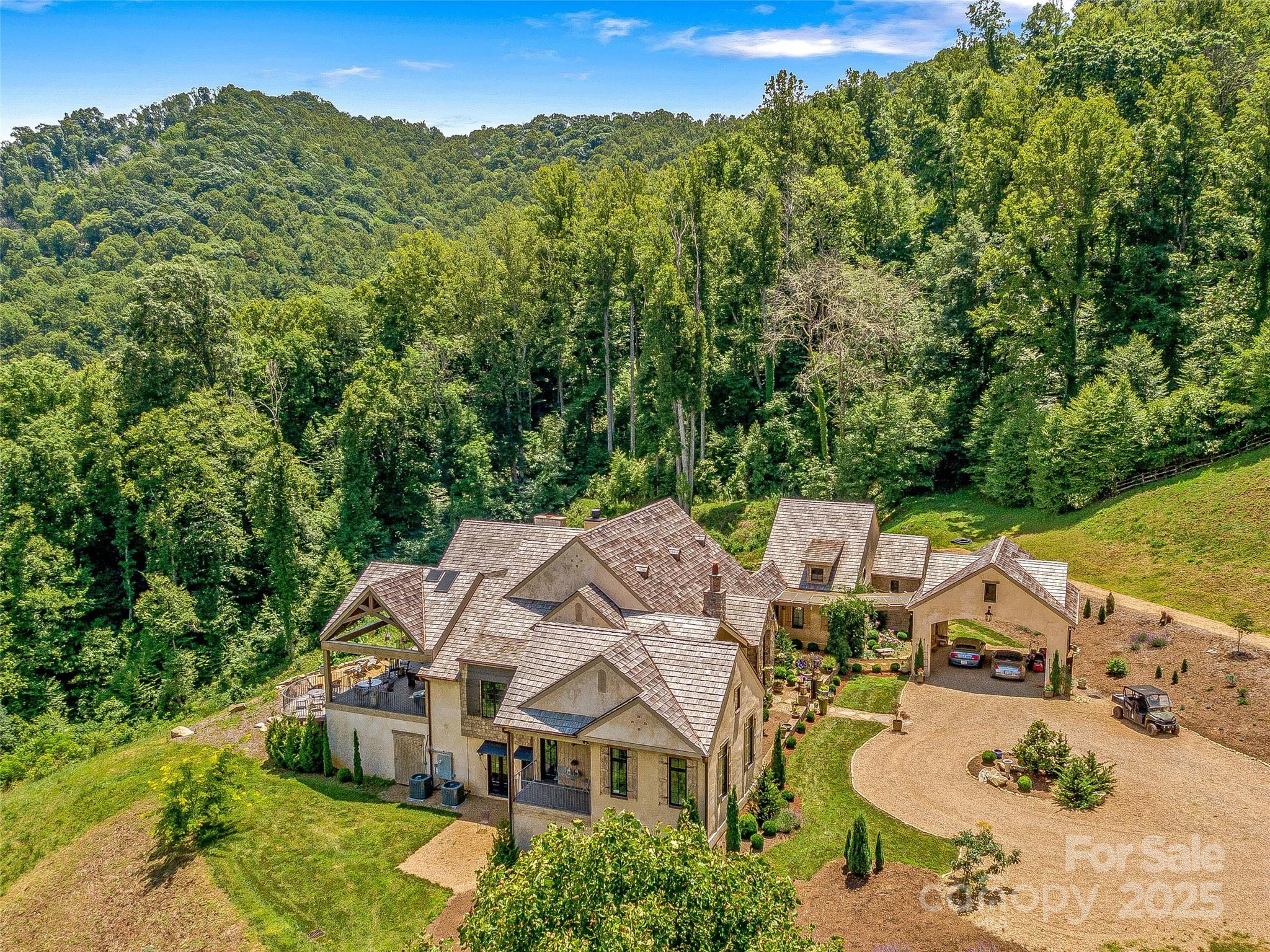 384 Doan Town Road Burnsville, NC 28714 - Photo 16 of 44 an aerial view of a house with a garden