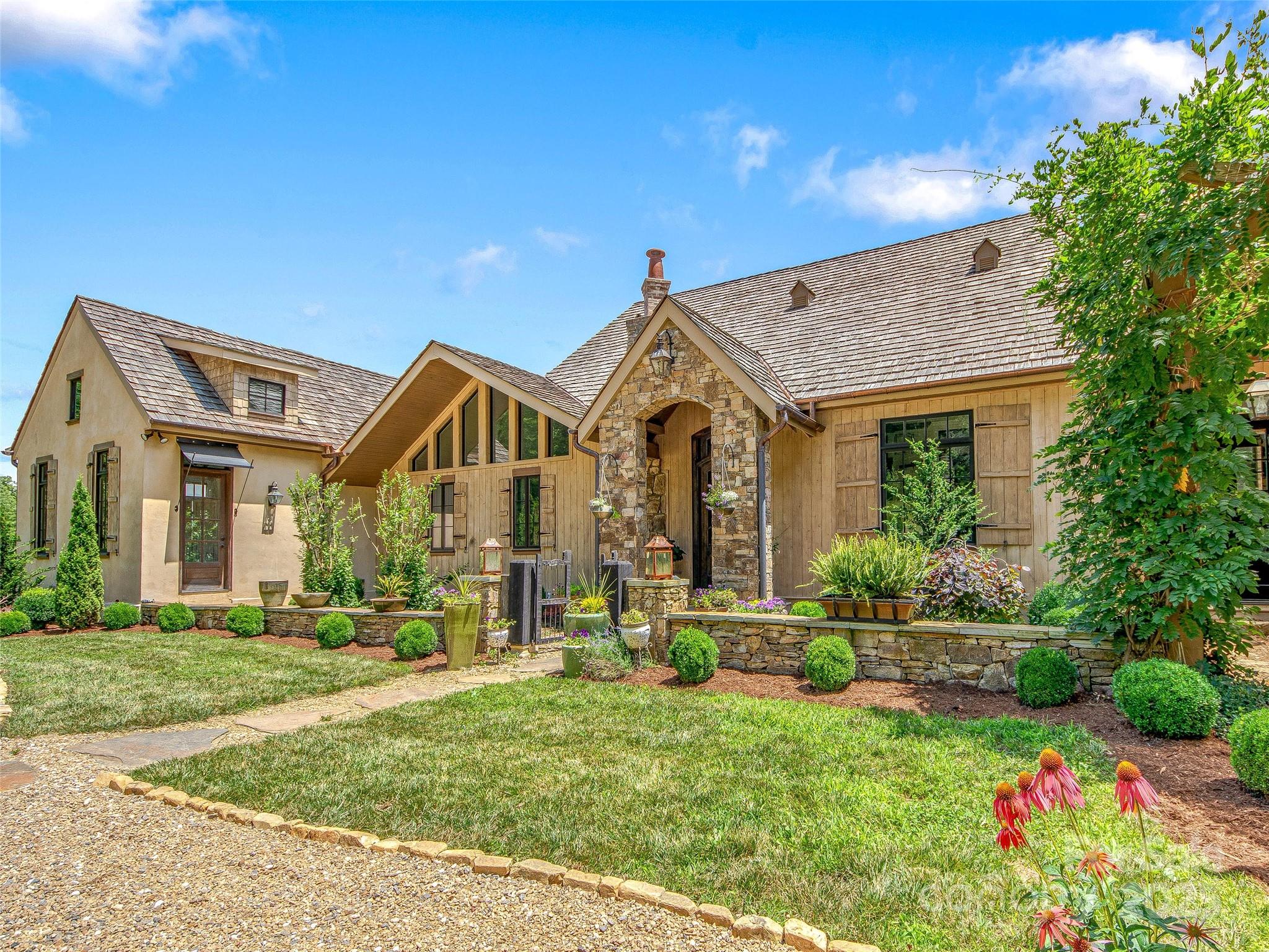 384 Doan Town Road Burnsville, NC 28714 - Photo 17 of 44 a view of a house with a big yard and potted plants