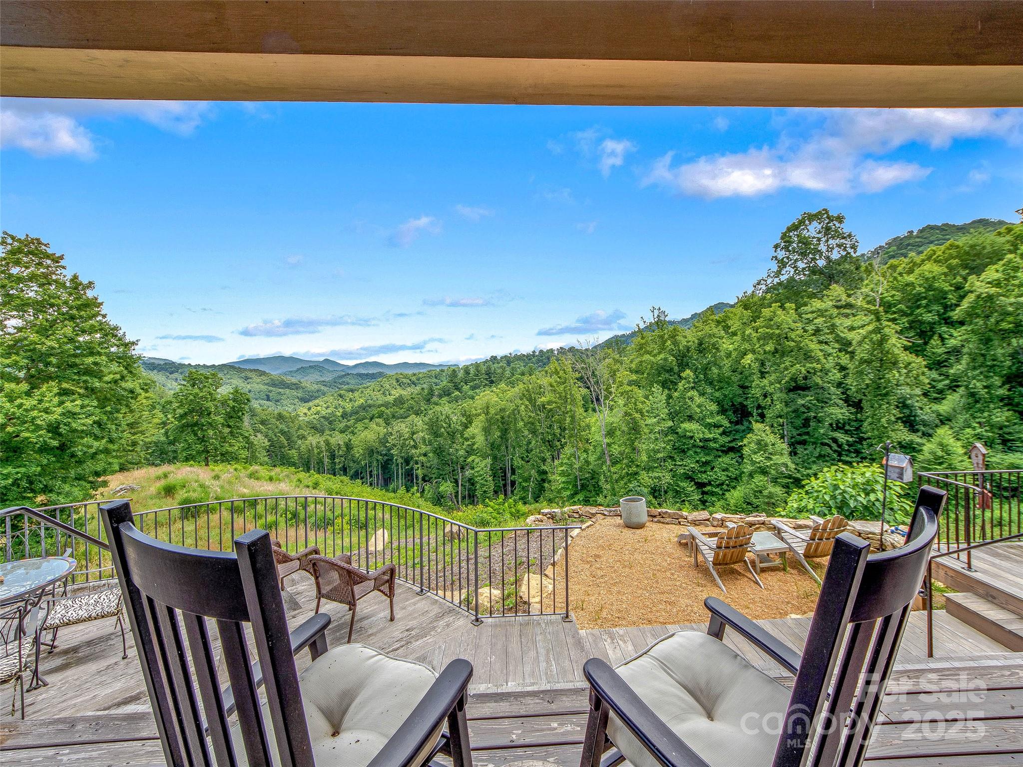 384 Doan Town Road Burnsville, NC 28714 - Photo 21 of 44 a view of a two chairs in the roof deck