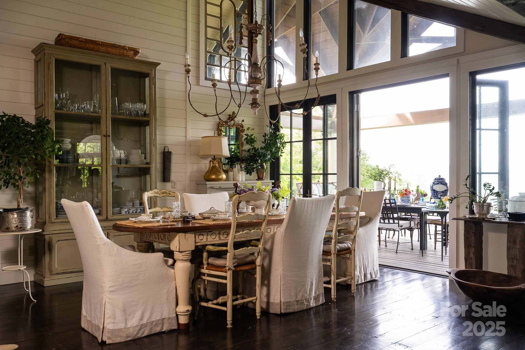 384 Doan Town Road Burnsville, NC 28714 - Photo 22 of 44 a dining room with furniture window and wooden floor