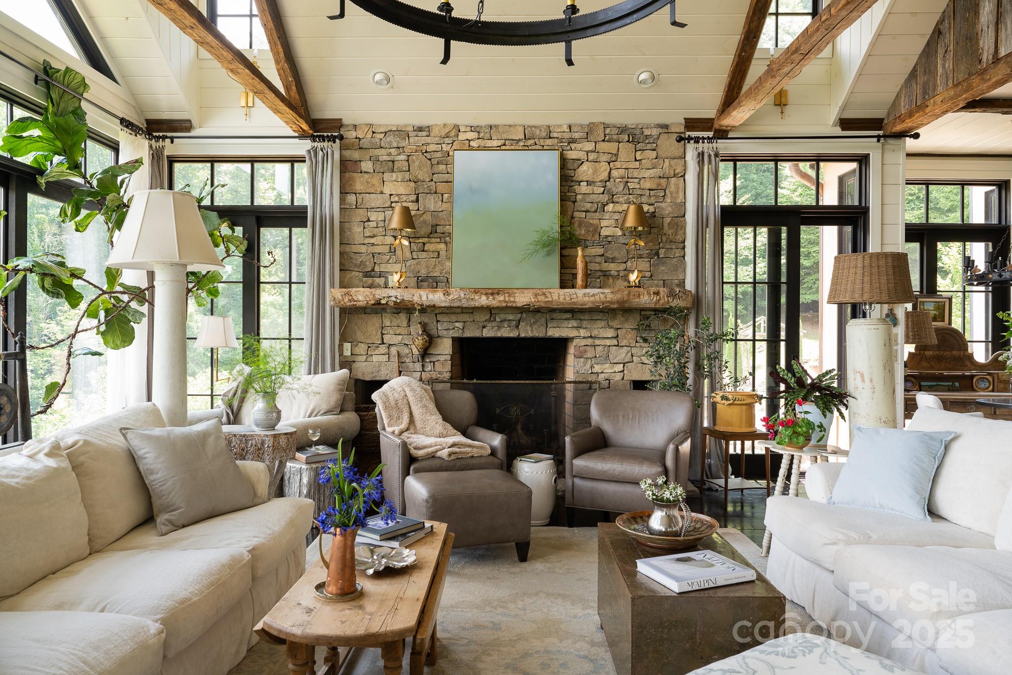 384 Doan Town Road Burnsville, NC 28714 - Photo 23 of 44 a living room with furniture fireplace and a large window