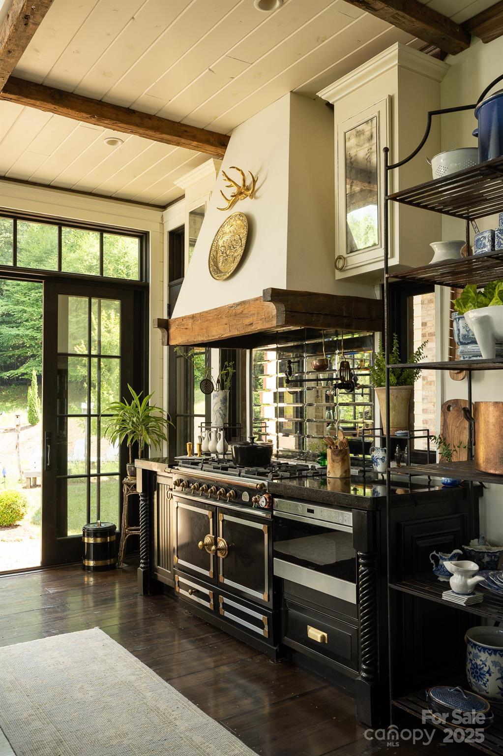 384 Doan Town Road Burnsville, NC 28714 - Photo 26 of 44 a kitchen with stainless steel appliances granite countertop a stove and a large window