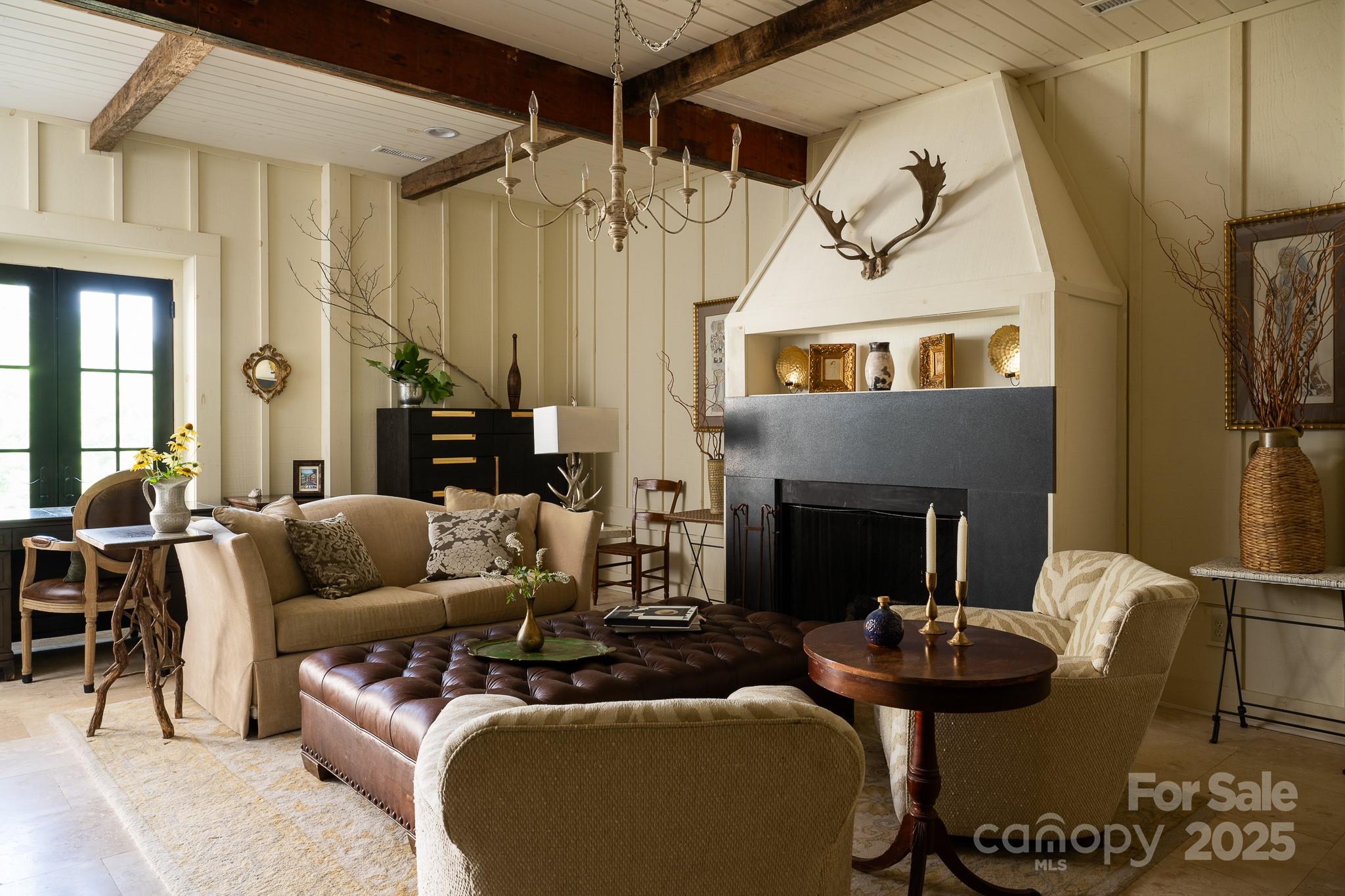 384 Doan Town Road Burnsville, NC 28714 - Photo 30 of 44 a living room with furniture and a fireplace