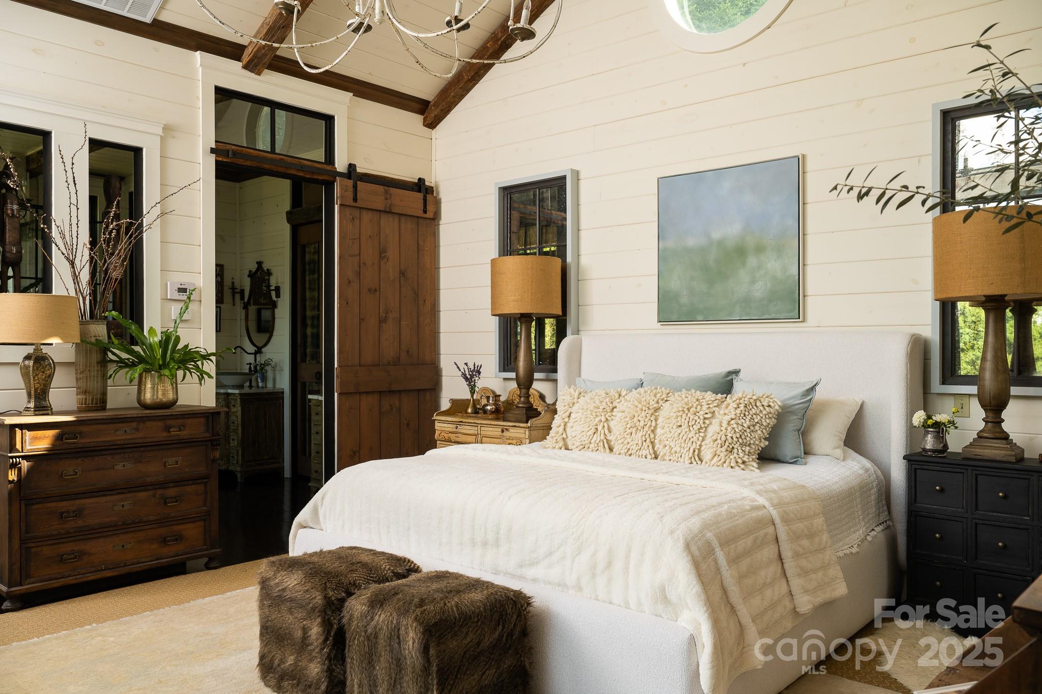 384 Doan Town Road Burnsville, NC 28714 - Photo 31 of 44 a bedroom with a bed and a dresser