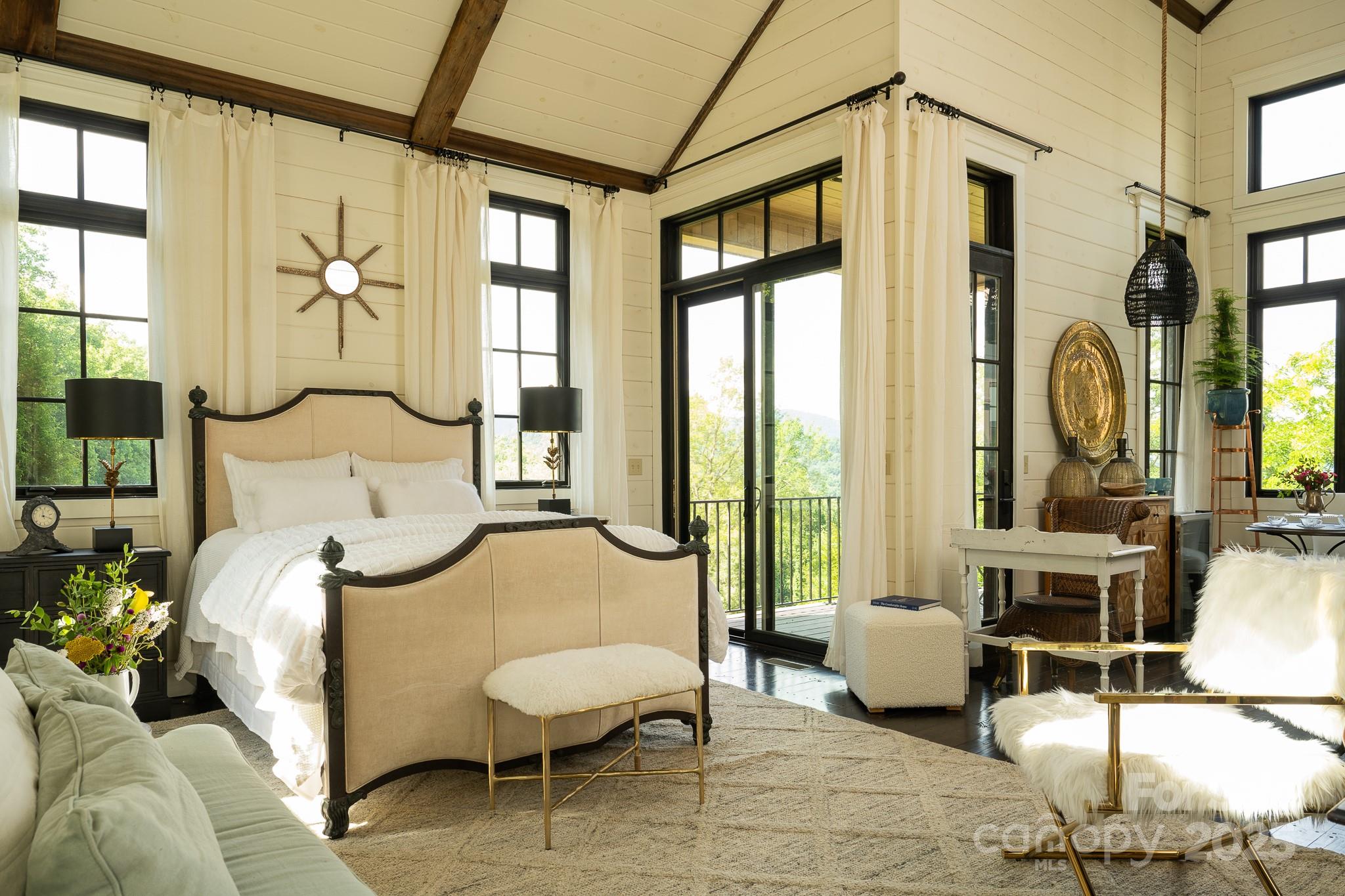 384 Doan Town Road Burnsville, NC 28714 - Photo 35 of 44 a bedroom with furniture and a large window