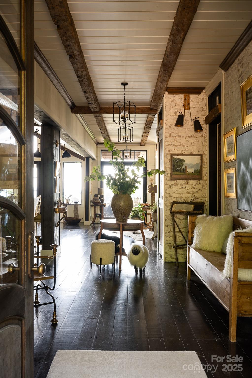 384 Doan Town Road Burnsville, NC 28714 - Photo 40 of 44 a living room with furniture wooden floor and a chandelier