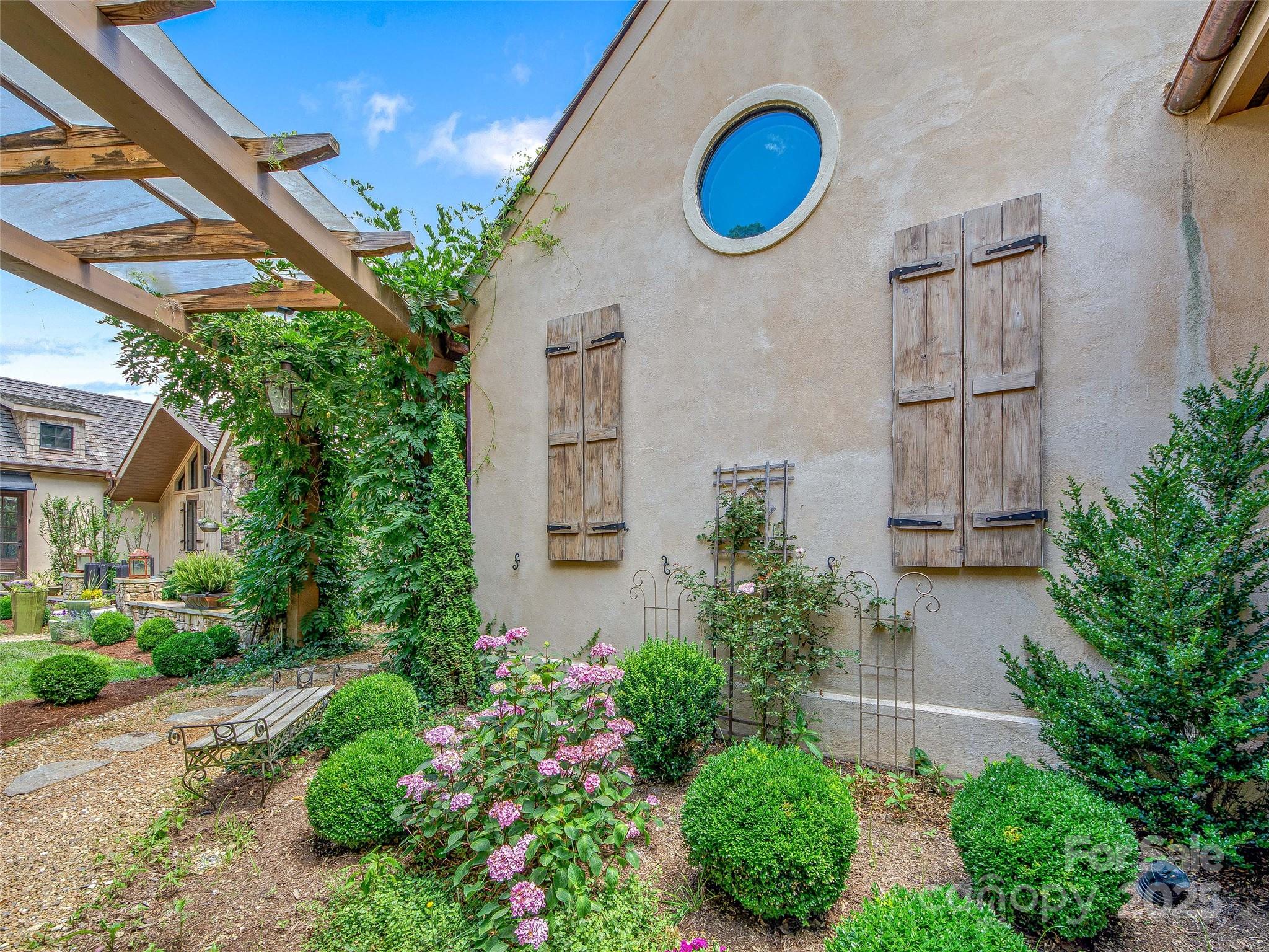 384 Doan Town Road Burnsville, NC 28714 - Photo 43 of 44 a front view of a house with a yard and potted plants