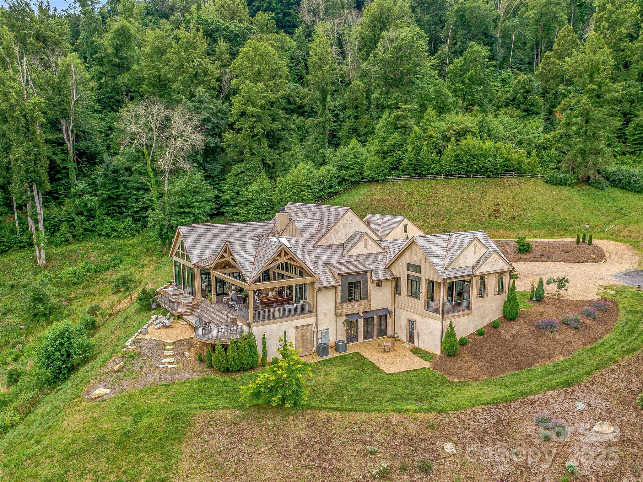 384 Doan Town Road Burnsville, NC 28714 - Photo 7 of 44 an aerial view of residential houses with yard and green space