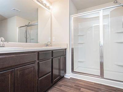 145 Townview Drive Woodstock, GA 30189 - Photo 12 of 21 a bathroom with a sink a mirror and a shower
