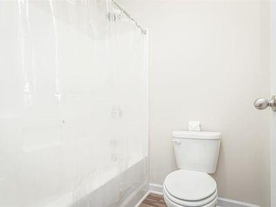 145 Townview Drive Woodstock, GA 30189 - Photo 17 of 21 a white toilet sitting next to a white cabinet
