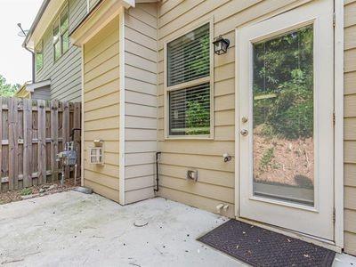145 Townview Drive Woodstock, GA 30189 - Photo 19 of 21 a view of a house with a door and wooden walls