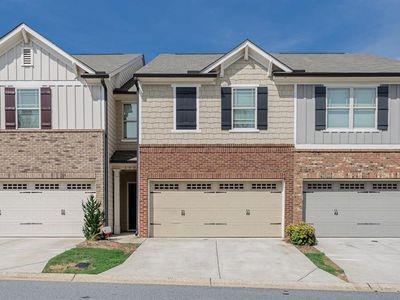145 Townview Drive Woodstock, GA 30189 - Photo 2 of 21 a front view of a house with a yard and garage
