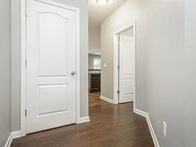 a kitchen with granite countertop stainless steel appliances a sink stove and refrigerator