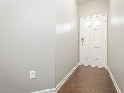 a kitchen with stainless steel appliances granite countertop a refrigerator stove and sink
