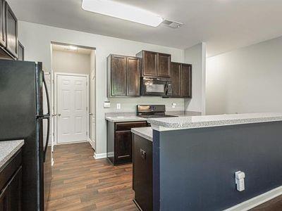 145 Townview Drive Woodstock, GA 30189 - Photo 6 of 21 a kitchen with stainless steel appliances granite countertop a refrigerator stove and sink