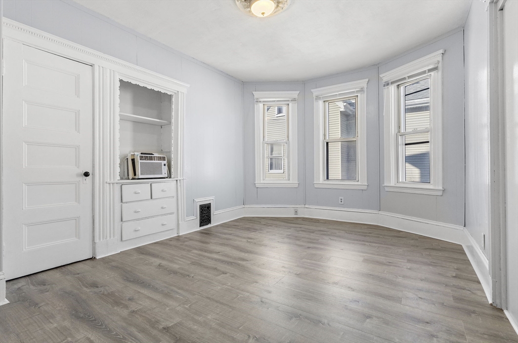 403 Ferry Street, Unit 2 Malden, MA 02148 - Photo 13 of 17 a view of empty room with wooden floor