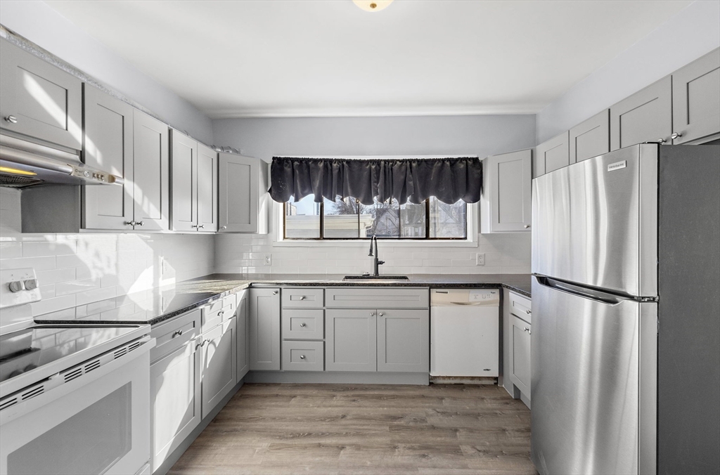 403 Ferry Street, Unit 2 Malden, MA 02148 - Photo 9 of 17 a kitchen with a sink appliances and cabinets