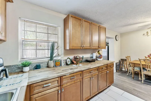 a kitchen with stainless steel appliances granite countertop sink stove and cabinets