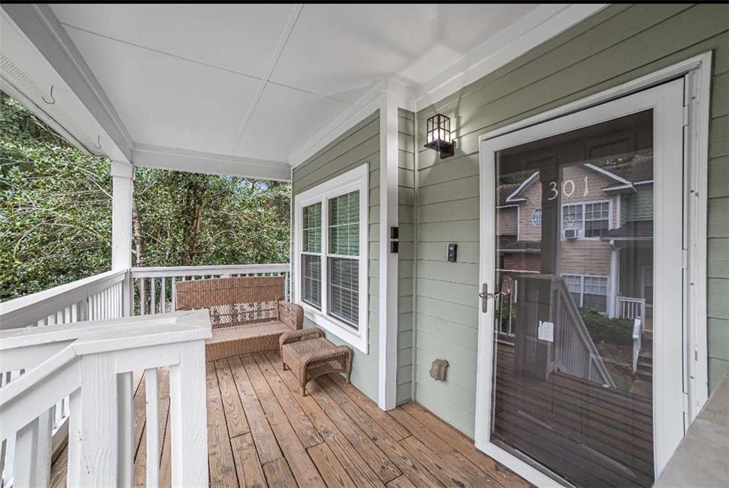 a view of a balcony with wooden floor