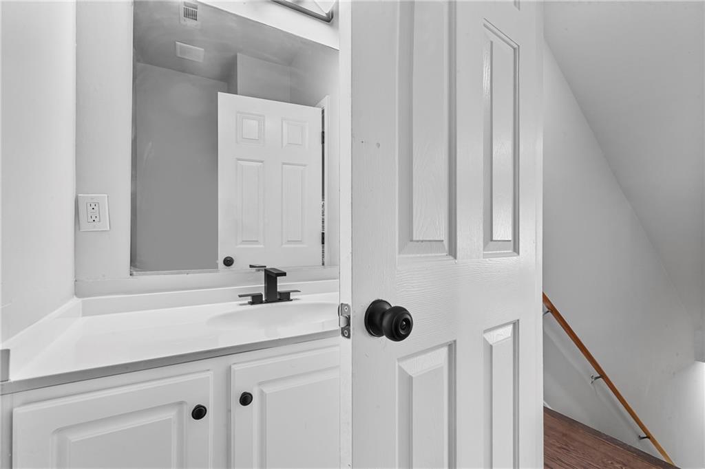 1731 Pryor Road Southwest, Unit 301 Atlanta, GA 30315 - Photo 11 of 29 a bathroom with a sink and a mirror