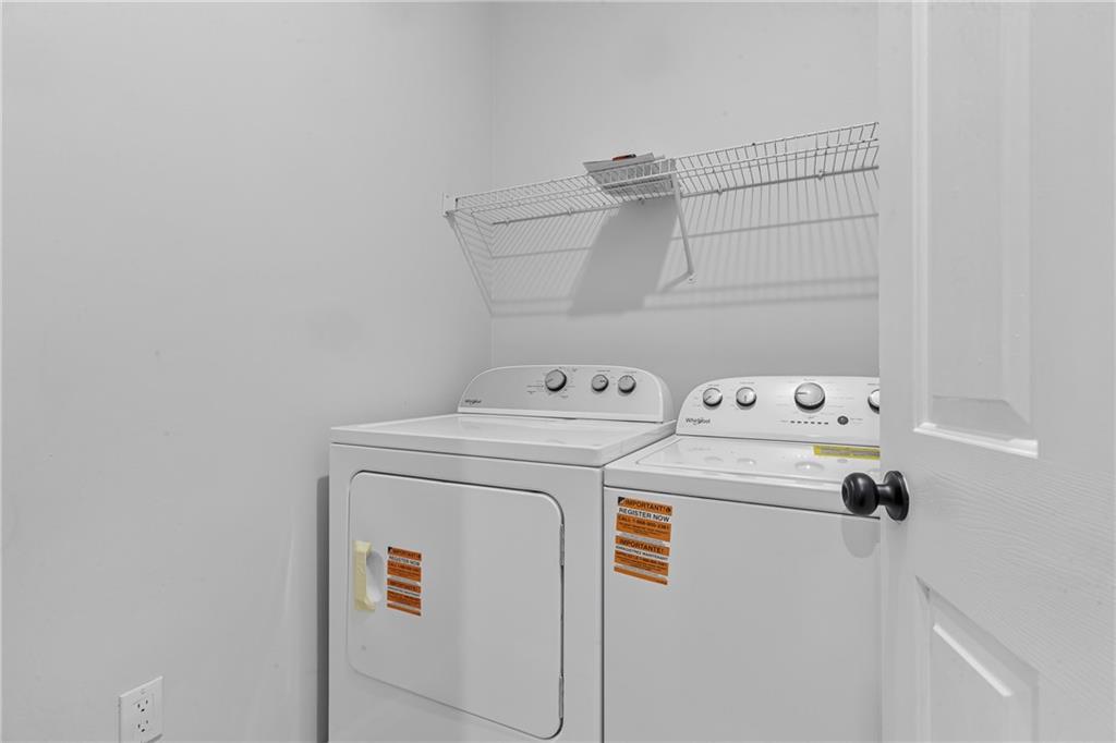 1731 Pryor Road Southwest, Unit 301 Atlanta, GA 30315 - Photo 12 of 29 a utility room with dryer and washer