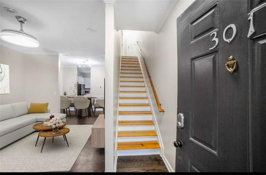 1731 Pryor Road Southwest, Unit 301 Atlanta, GA 30315 - Photo 2 of 29 a living room with furniture and a stairs